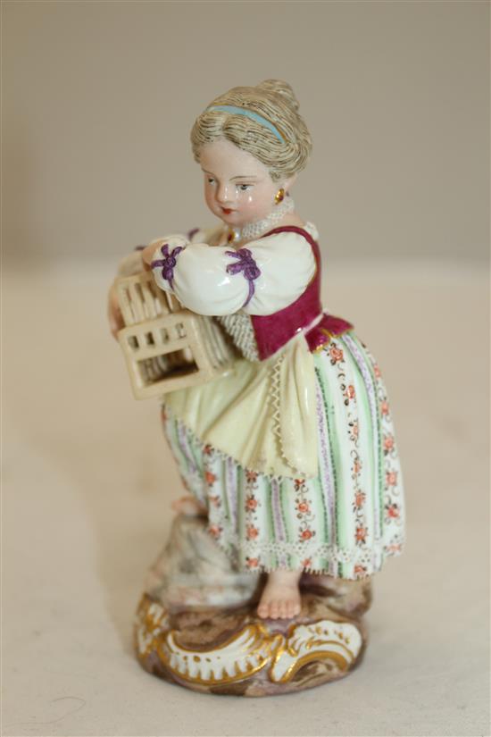 A Meissen figure of girl holding a birdcage, 19th century, 11.5cm